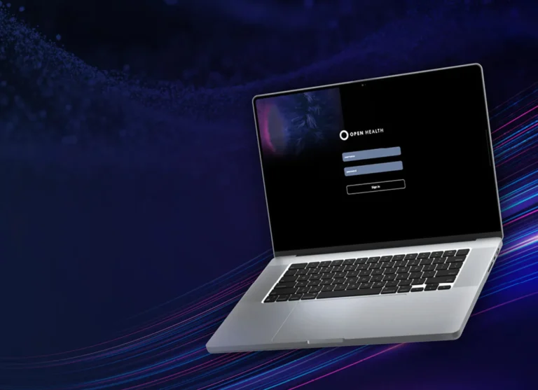 Laptop showing the OPEN Health platform login screen