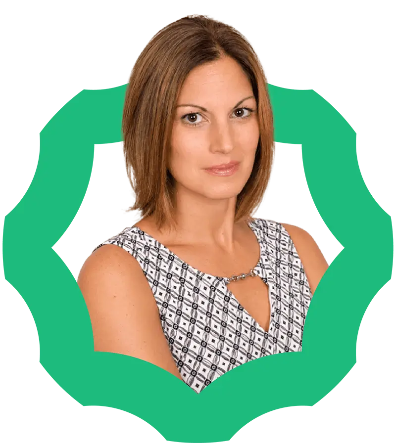 A woman with straight, shoulder-length brown hair is wearing a patterned sleeveless top. She is posing with a neutral expression inside a green geometric frame on a white background.