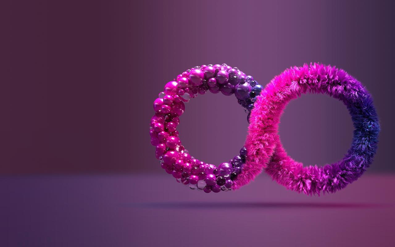 Two interlocking rings stand on a purple surface. One ring is shiny with reflective spheres, and the other is covered in soft, furry pink and blue textures. The background is a smooth gradient of purple tones.