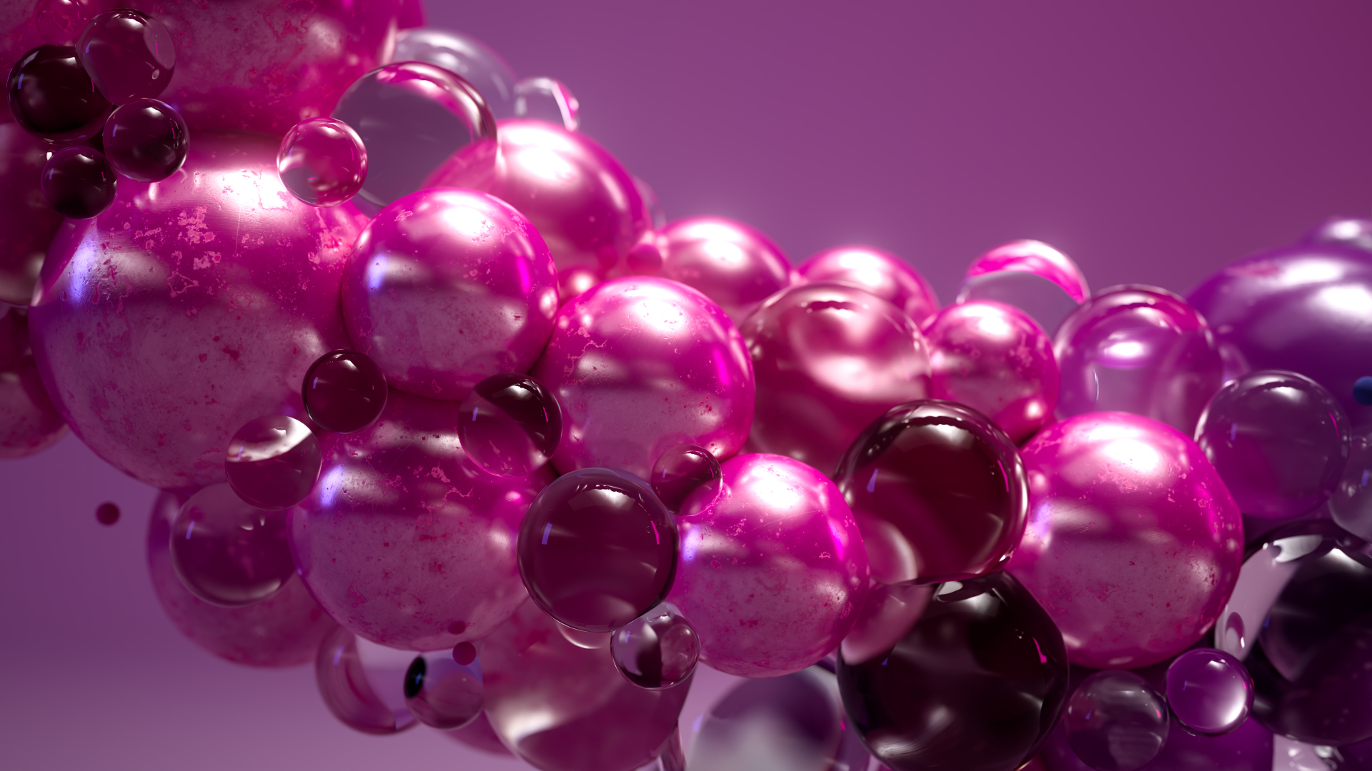 A cluster of shiny, pink and purple spheres of varying sizes, reflecting light against a soft, gradient pink background.