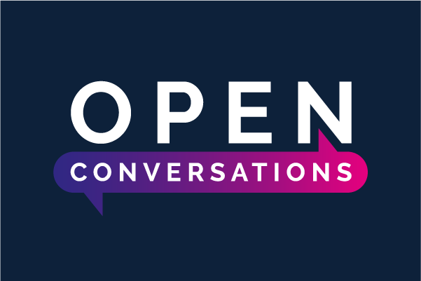 Text logo reading OPEN CONVERSATIONS on a dark blue background. CONVERSATIONS is inside a purple-pink speech bubble that extends from the word OPEN.