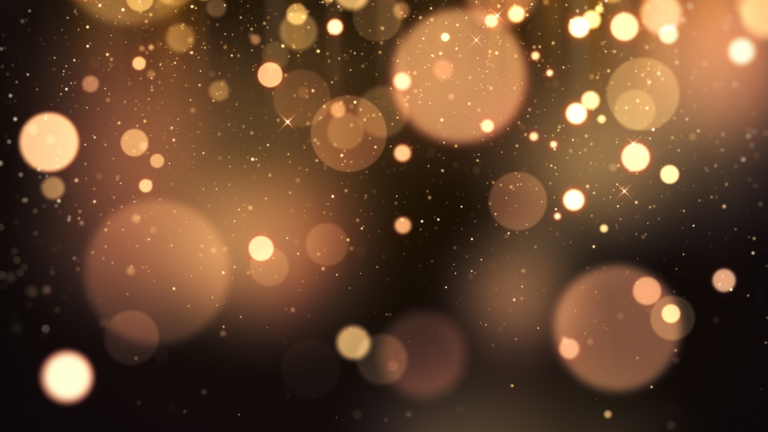 Golden bokeh lights and soft glowing circles float on a dark, blurred background, creating a warm and festive ambience.