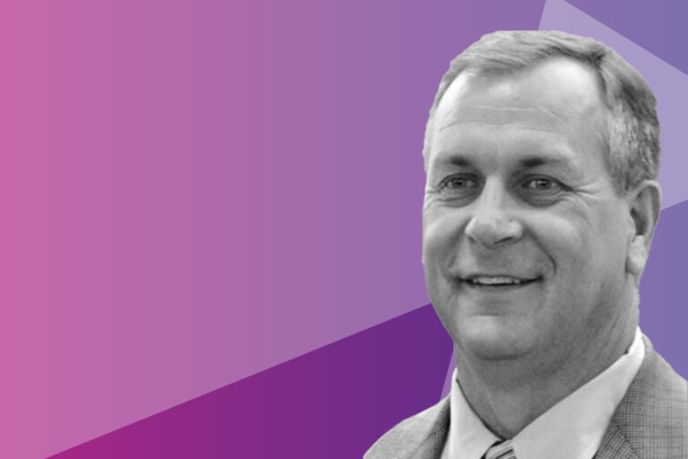 A smiling man in a suit appears in the bottom right corner, with a purple and pink geometric background filling the rest of the image.