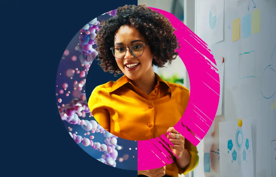 A woman with curly hair and glasses, wearing a yellow shirt, smiles whilst standing by a whiteboard with charts. The image features colourful circular graphics around her.