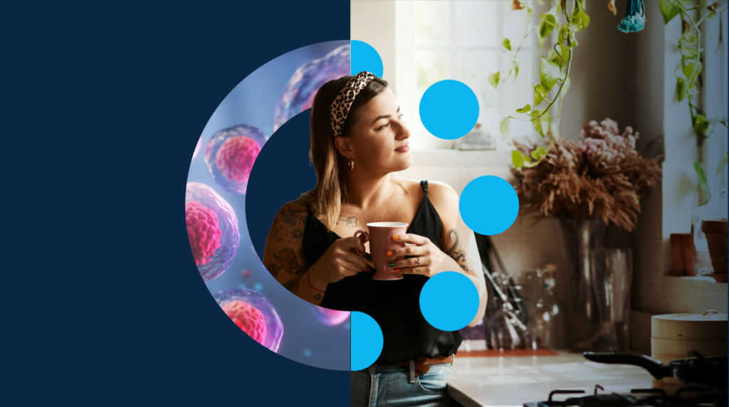 A woman with tattoos holds a mug in a cosy kitchen, overlaid with blue circles and a half-circle image of microscopic cells on a dark blue background.