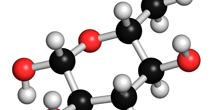 3D molecular model showing black, red, and white spheres connected by rods, representing carbon, oxygen, and hydrogen atoms, respectively. The structure is commonly used in chemical or biology contexts.