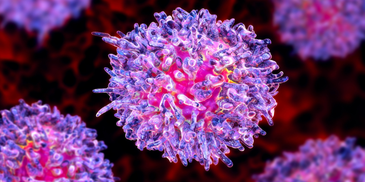 A close-up, 3D illustration of a spiky, spherical cell coloured in shades of pink, purple, and blue, set against a dark red background.