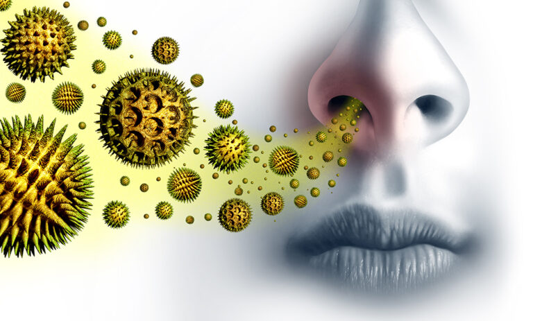 A close-up of a nose and mouth with illustrated yellow pollen particles floating towards the nostrils, symbolising inhalation of allergens or seasonal allergies.